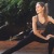 lifestyle image of a woman doing yoga